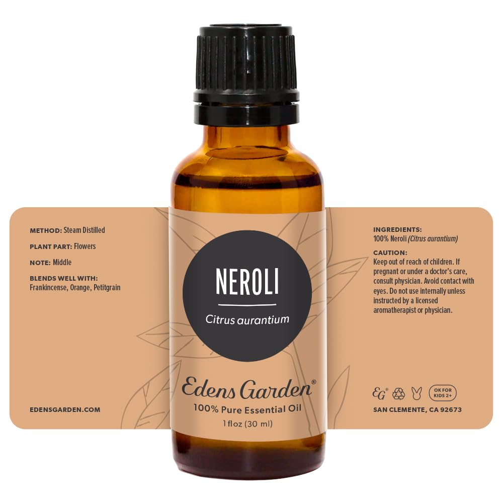 Edens Garden Neroli oil with floral blossoms background reflecting origins.