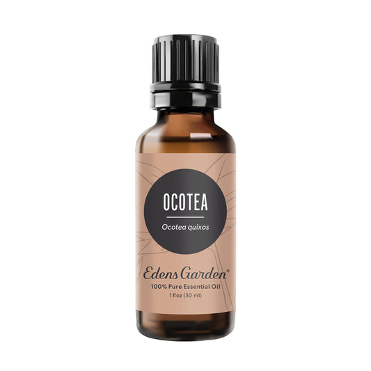 Edens Garden Ocotea essential oil bottle 30 ml pouring for calming diffused aroma.