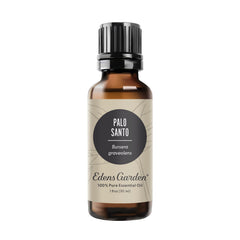 Edens Garden Palo Santo essential oil bottle close-up for calming aromatherapy.
