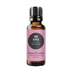 Edens Garden Pink Pepper essential oil bottle on wood, diffusion-ready aroma
