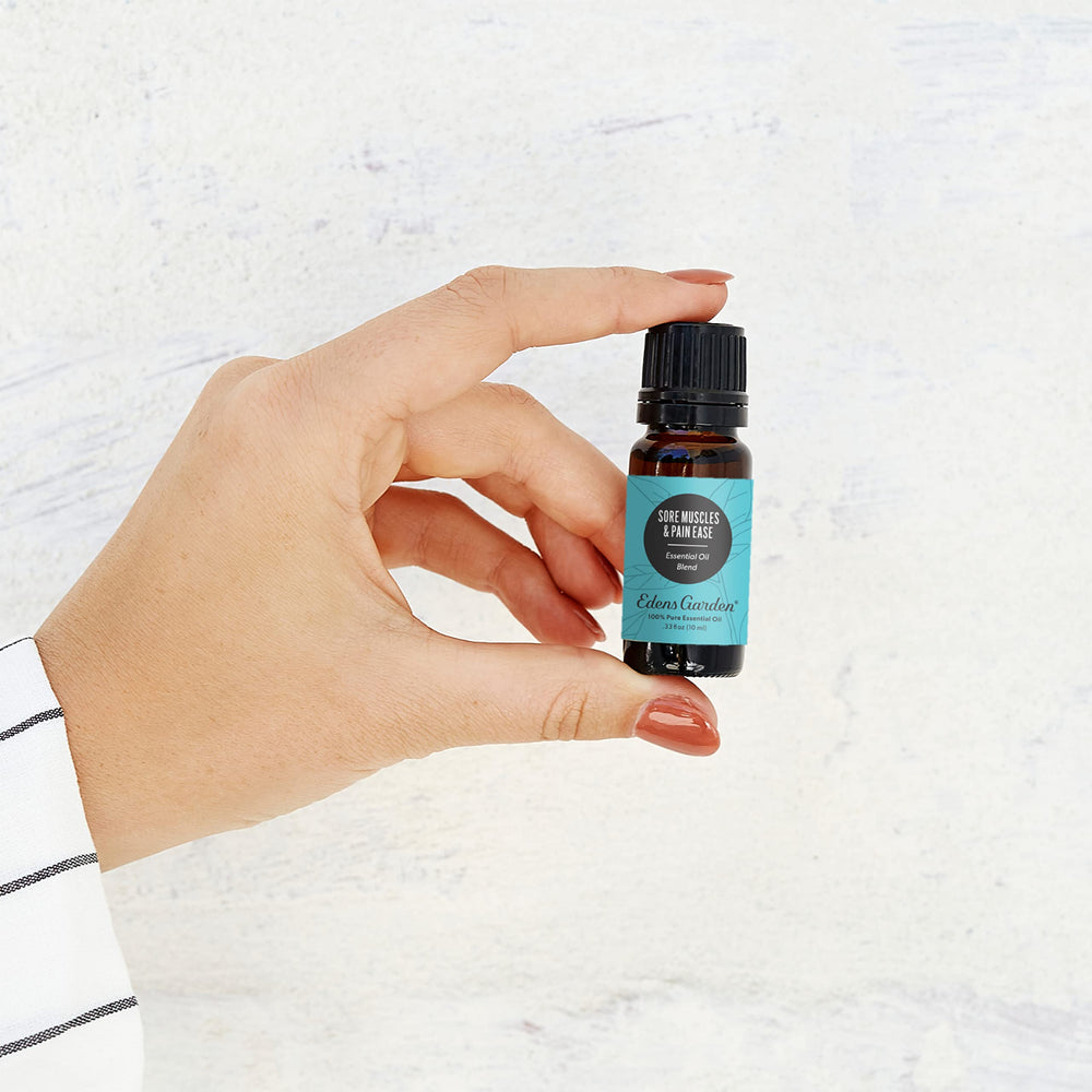 Close up of Edens Garden Sore Muscles Pain Ease label highlighting pure essential oils