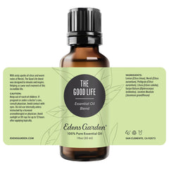 Edens Garden The Good Life diffuser near flowers suggests uplifting ambience for any room.