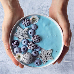 Ellie's Best blue spirulina indigo tint added to smoothies and bowls.