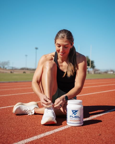EndurElite Endurance Fuel Elite orange flavor in a glass ready to hydrate during training.