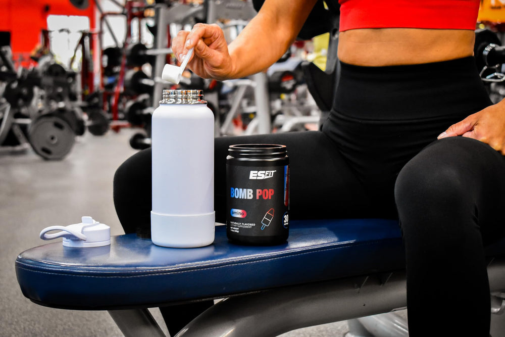 ES FIT Amino Powder tub front displaying Bomb Pop flavor and certification.