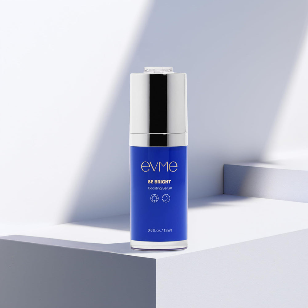Applying Evme Boosting Serum gently as part of daily skincare routine.