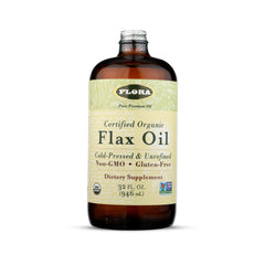 Flora Flax Oil bottle in amber glass on countertop supports daily omega intake.