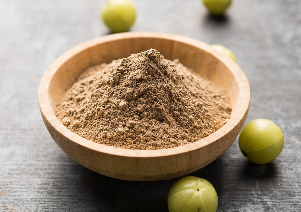 Food to Live amla powder steeped in tea with warm aroma