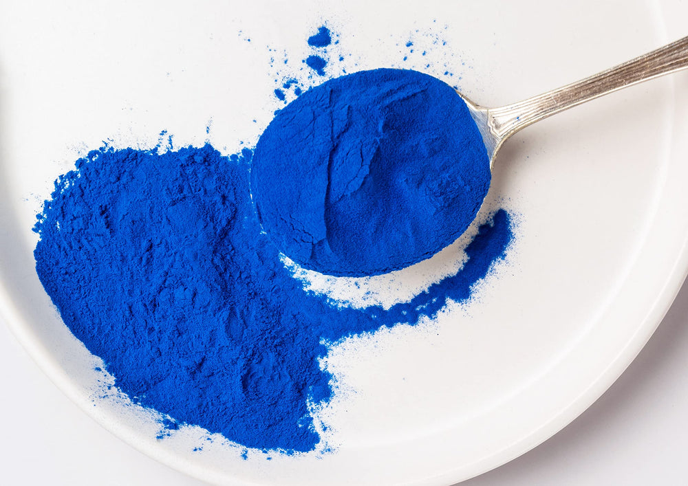 Food to Live Blue Spirulina Powder latte shot demonstrates color boost in beverages.