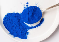 Food to Live Blue Spirulina Powder latte shot demonstrates color boost in beverages.