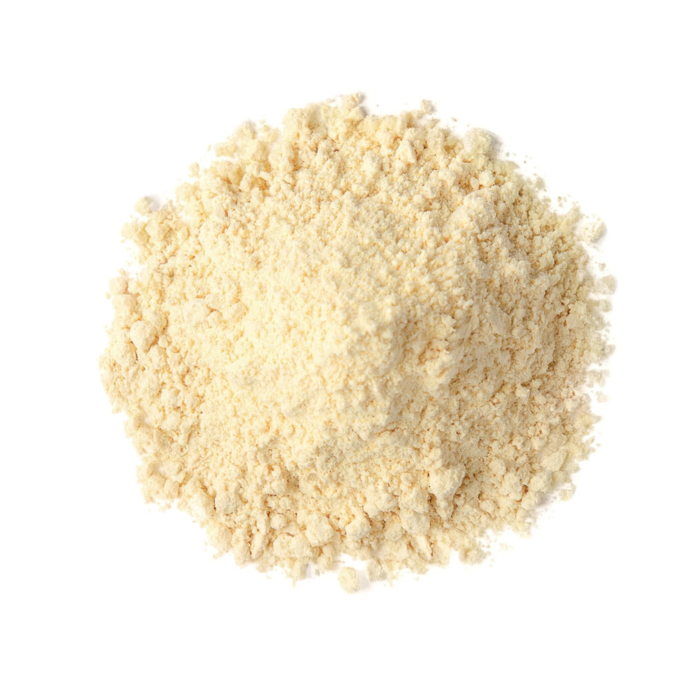 Food to Live pea protein powder being poured into a shaker.