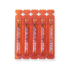 Fosfo B-12 ampoules being diluted in water for easy intake