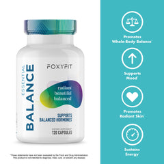 A hand holding FoxyFit Essential Balance bottle during morning routine for daily wellness.