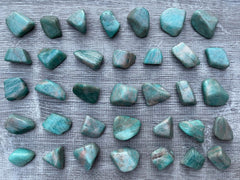 GAF Treasures polished amazonite stones reflecting natural variety and patterns.