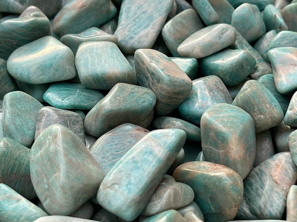 GAF Treasures amazonite tumbled stones variety with size and color differences.