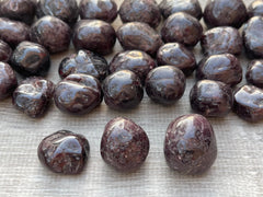 GAF TREASURES Garnet Palm Stone: tactile palm stone for calming sessions and confidence boosts.