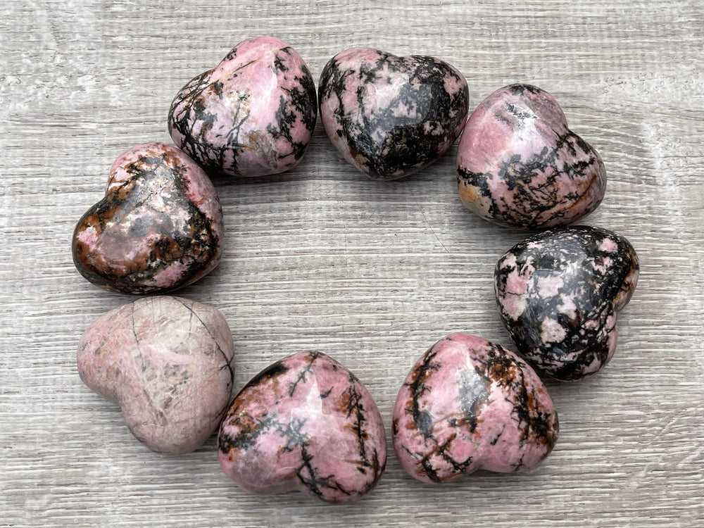GAF Treasures Rhodonite Heart closeup showing pink hues and smooth polish for calm tactile use