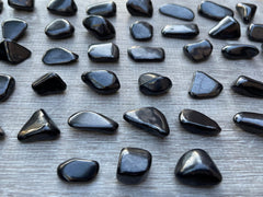 GAF TREASURES Shungite stones sized 0.75–1.25 inches for display.