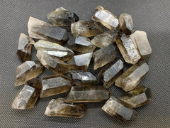GAF Treasures smoky quartz point rough stone enhances focus and reduces stress during meditation.
