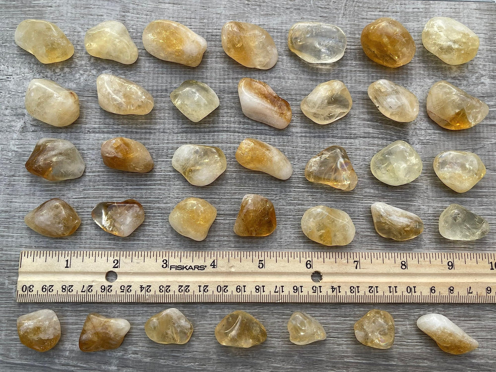 GAF TREASURES Display-ready citrine tumbled stones for home decor.