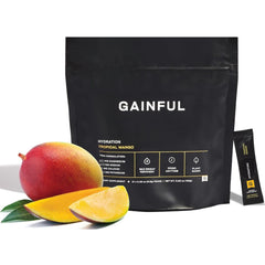 Gainful Hydration Tropical Mango packet dissolving in water for quick hydration.