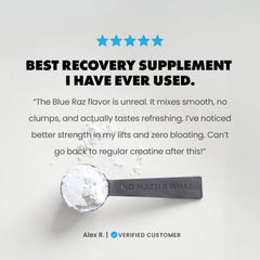 GAINS IN BULK blue raspberry creatine powder in a glass with clear solution.