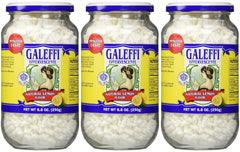 Galeffi lemon effervescent sticks dissolving in water for a refreshing after-meal drink.
