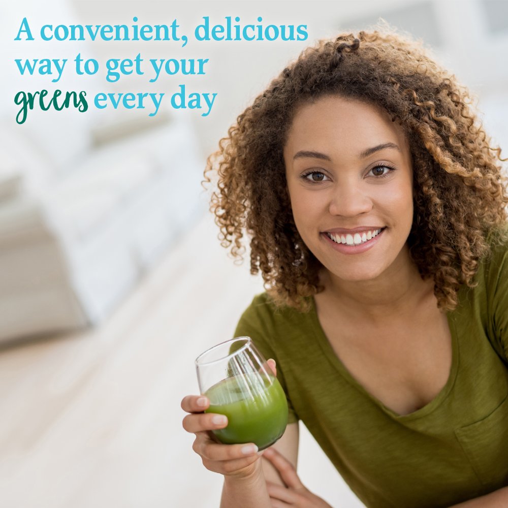 Garden of Life Perfect Food scoop pouring into a glass for quick greens