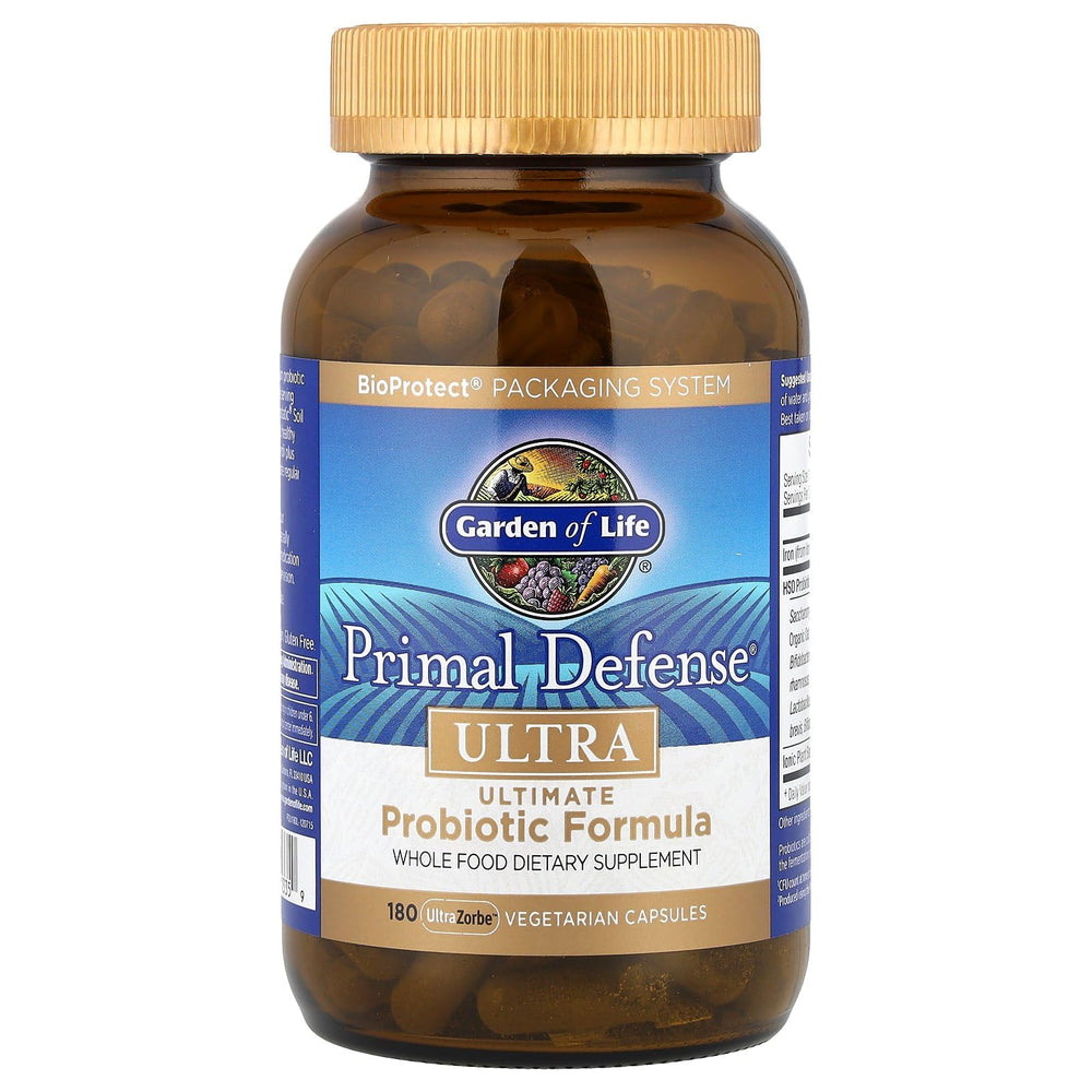 Garden of Life Primal Defense Ultra bottle with glass of water for daily use