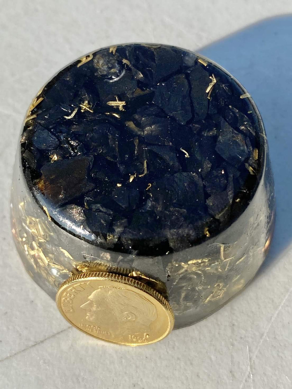 Generic Shungite Elite Noble tower buster glows softly to enhance ambient energy.