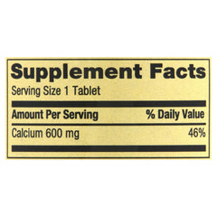 Generic Spring Valley Calcium 600mg bottle being poured into a glass.