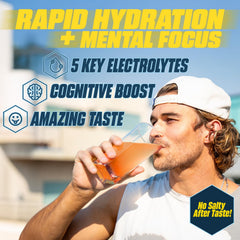G Fuel Electrolytes Orange Oasis pour into glass signaling instant hydration and focus.