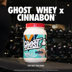 Scoop of GHOST Whey x Cinnabon powder ready for a flavorful post-workout shake.