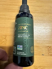 Global Healing Center vegan zinc liquid bottle against white background communicates gentle mineral support.