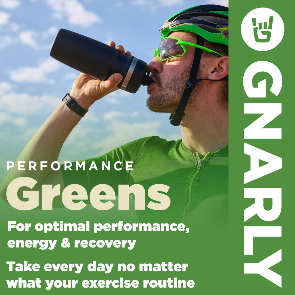 Gnarly Nutrition Greens Blueberry Acai powder dispense over a glass for quick hydration.