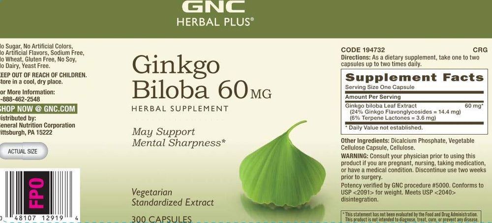 Person studying at a desk with GNC Herbal Plus Ginkgo Biloba for study focus.