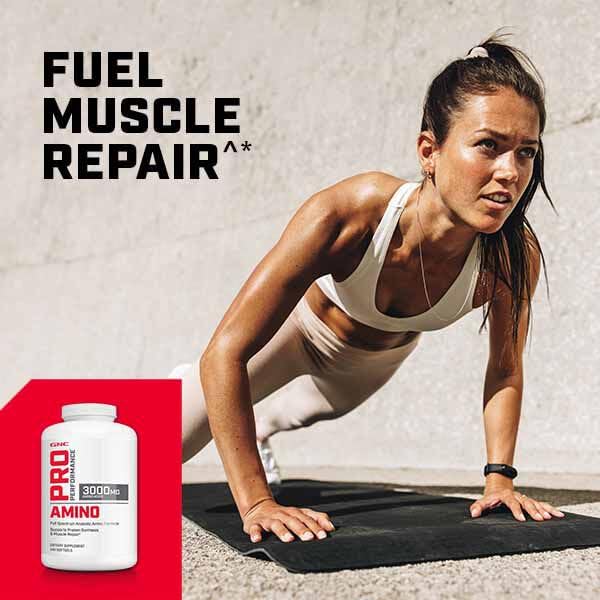 GNC Pro Performance Amino 3000 on workout mat beside water