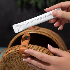 Close-up of Go Mouthwash travel packet highlighting compact, mess-free travel freshness.