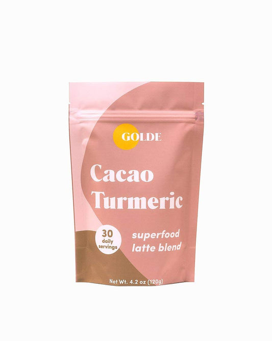 GOLDE cacao turmeric latte blend canister shows creamy plant-based powder.