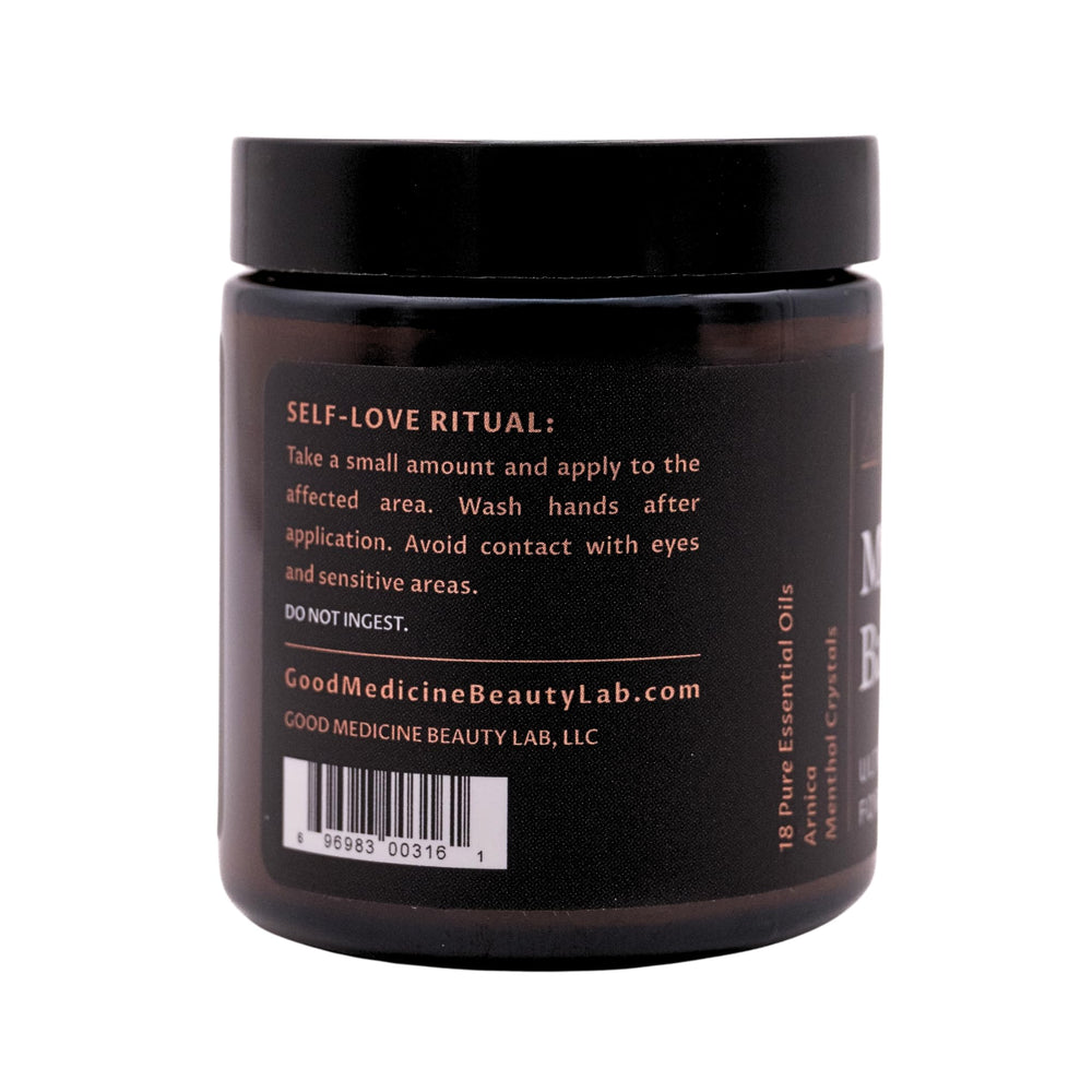 GOOD MEDICINE Muscle Balm applied to shoulder for soothing relief