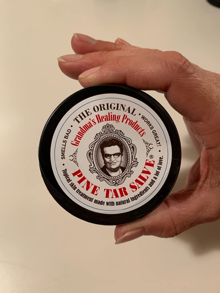 Texture close-up of Grandma's Pine Tar Salve ready for application.