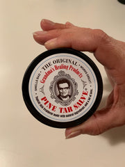 Texture close-up of Grandma's Pine Tar Salve ready for application.