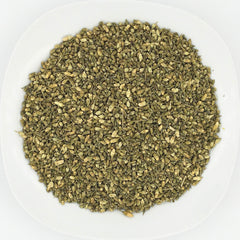 Greenlike Huai Hua Mi tea-steeping scene showing delicate color and aroma.