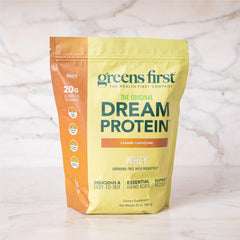 Greens First Dream Protein Whey poured into shaker for a quick meal.