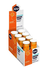 GU Energy Hydration Tabs orange tablet dissolving in water for quick electrolyte balance.