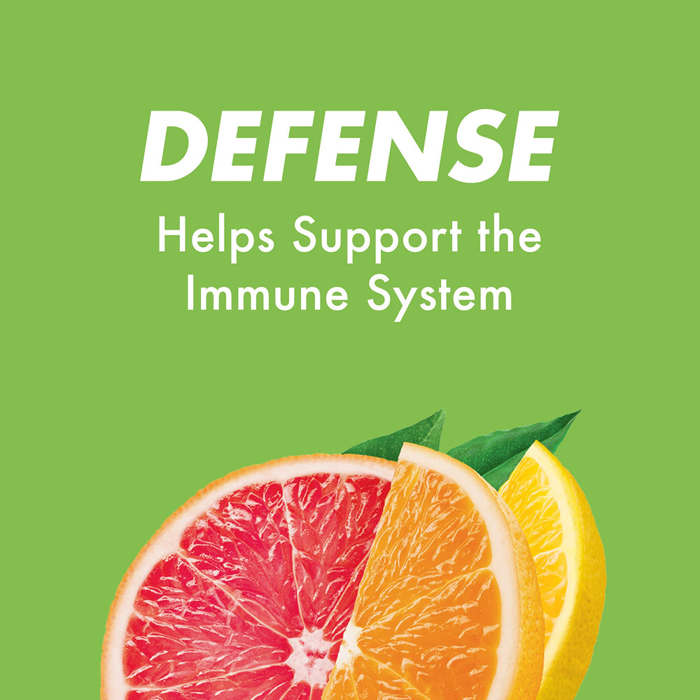HALLS Defense mixed-flavors display with vibrant citrus colors.