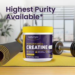Pouring Healthy Origins unflavored powder into a shaker for mixing.