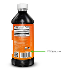 Pour shot of papaya leaf extract with drops ready to add to a glass