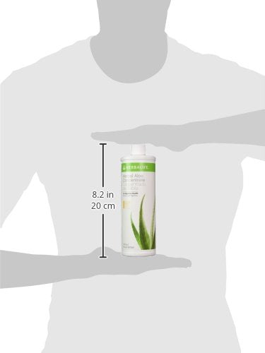 Chilled Herbal Aloe Drink Mango concentrate in a glass ready to sip.