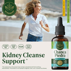 Chanca Piedra drops pouring from the bottle for easy dosing.